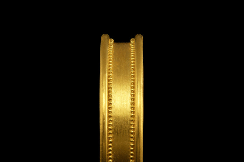 A 22k gold band with cylindrical edges and two lines of hand-placed granules - side