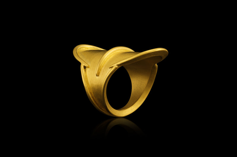 A shield-shaped 22k gold ring - angled view