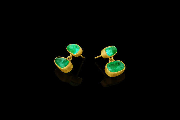 Tumbled emerald drop earrings. Post back.  Side view.