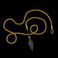Persian bronze arrowhead (c. 1200-1800 BCE) in a modern gold frame accented with diamonds on a handwoven gold chain.