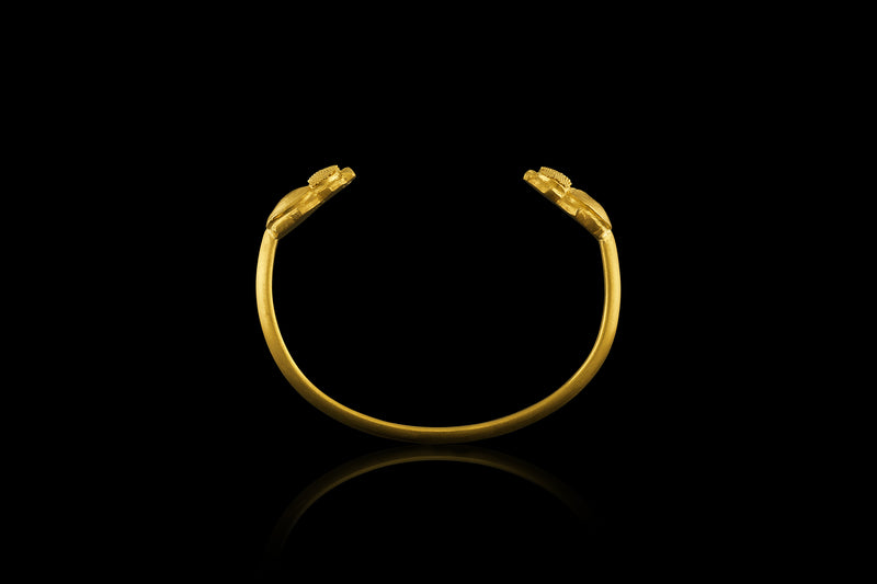 A 22-karat gold cuff bracelet with scarab beetle terminals- Side view