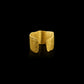 An ear cuff formed from a hammered sheet of gold with an organic edge inspired by papyrus, the reed paper used by the ancient Egyptians.
