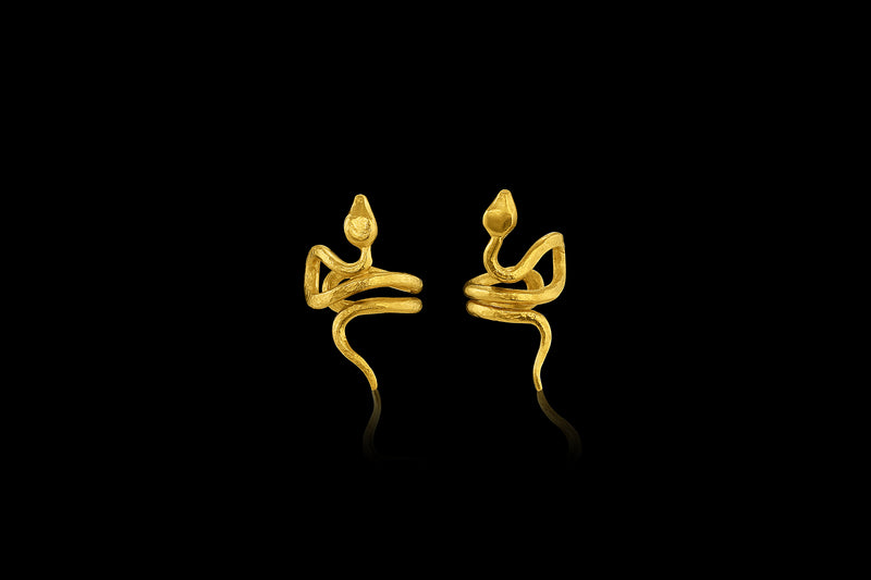 With sinuous curves that climb up the ear, this 22-karat yellow gold snake cuff is beautifully balanced. pair.