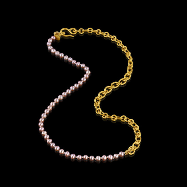 Elegant and playful, this combination necklace is half pink freshwater pearls and half handmade chain in 22k yellow gold. Closes with our signature shepherd's hook clasp. Pearls are individually hand tied on silk.