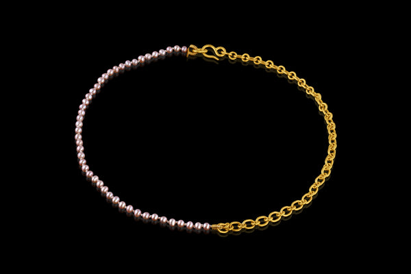 Elegant and playful, this combination necklace is half pink freshwater pearls and half handmade chain in 22k yellow gold. Closes with our signature shepherd's hook clasp. Pearls are individually hand tied on silk.