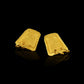 Earrings based on the shape of ancient tablets, featuring a textured surface and suspending two hoops.  