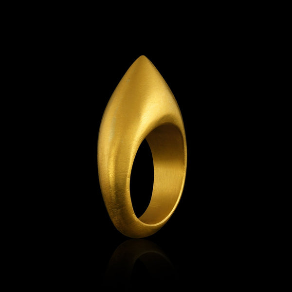 A hollow gold point ring, raise by hand, inspired by the ancient design of archer's rings. 3/4 profile view. 