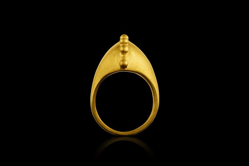 A 22k gold ring with a spine of golden spheres - side view
