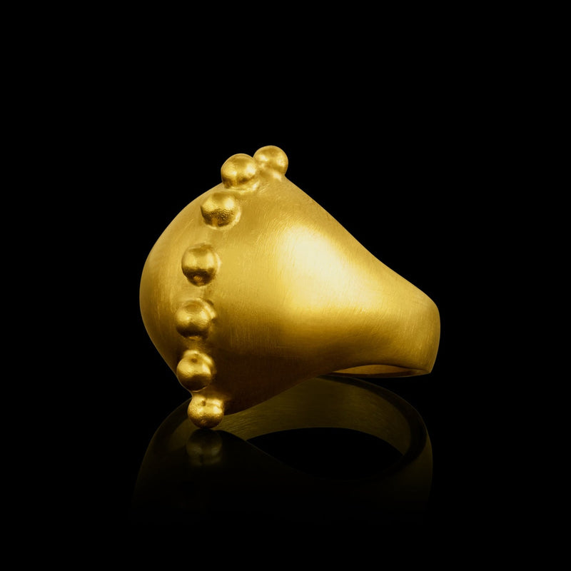 A 22k gold ring with a spine of golden spheres