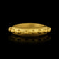 A 22k gold band ring accented with gold spheres - side view
