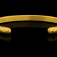A playful 22-karat gold cuff bracelet accented with spheres of gold - Back view