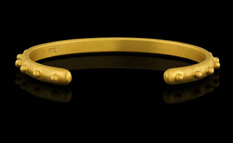 A playful 22-karat gold cuff bracelet accented with spheres of gold - Back view